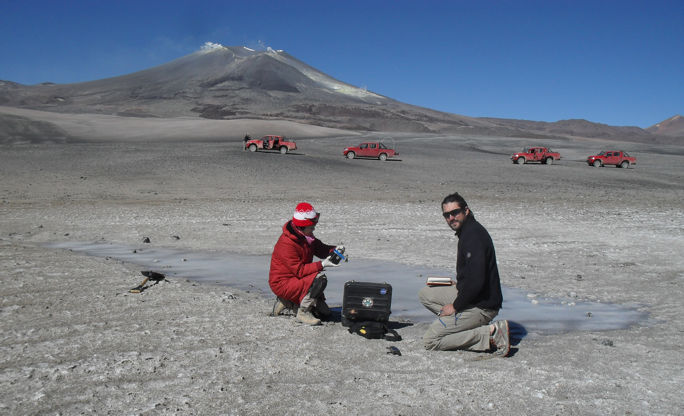 Prof. Alian Wang and Dr. Pablo Sobron (Canadian Space Agency) are deploying two WashUWUSTL-built water infrared (WIR) and Bio-UV-Fluorescence (BUF) sensors onto the salty ice at Laguna de Azufera (Lake of Sulfur) in Atacama, Chile.